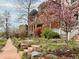 Beautifully landscaped front yard with colorful flowers and a brick sidewalk at 3337 Decatur St, Denver, CO 80211