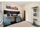 Home office space with triple monitor setup and view of the entryway at 3337 Decatur St, Denver, CO 80211