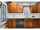 The kitchen has wooden cabinets, stainless steel appliances, and counterspace at 3337 Decatur St, Denver, CO 80211