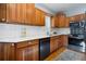 This kitchen offers stainless steel appliances, wooden cabinets, and lots of counterspace at 3337 Decatur St, Denver, CO 80211