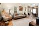 Cozy living room features hardwood floors, decorative fireplace, and comfortable seating at 3337 Decatur St, Denver, CO 80211