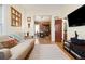 Cozy living room with wood floors and a comfortable seating arrangement, flowing into the adjacent dining area at 3337 Decatur St, Denver, CO 80211