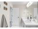 Bright bathroom with double sink vanity and modern fixtures at 7678 S Old Hammer Way, Aurora, CO 80016