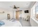 Light and bright bedroom with ceiling fan, barn door and view at 7678 S Old Hammer Way, Aurora, CO 80016