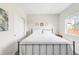 Cozy bedroom featuring a comfortable bed, natural light, and simple decor for a relaxing ambiance at 7678 S Old Hammer Way, Aurora, CO 80016