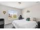 Bright bedroom with large window and work area at 7678 S Old Hammer Way, Aurora, CO 80016