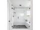 Modern walk-in shower featuring glass enclosure and subway tile at 7678 S Old Hammer Way, Aurora, CO 80016
