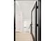 Hallway featuring a modern black-framed glass door at 277 S Jackson St, Denver, CO 80209