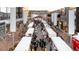 An aerial view shows rows of bustling holiday market stalls, creating a lively seasonal atmosphere at 277 S Jackson St, Denver, CO 80209