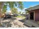 Large backyard has room for parking and is overgrown with mature trees at 358 S Osceola St, Denver, CO 80219