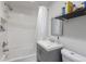 Clean and bright bathroom with a modern vanity, tiled shower, and well-maintained fixtures at 358 S Osceola St, Denver, CO 80219