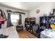 Bright bedroom with wood floors, natural light, and neutral walls at 358 S Osceola St, Denver, CO 80219