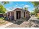 Back of the home with detached garage and gravel parking area at 358 S Osceola St, Denver, CO 80219