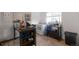 Bright kitchen with white appliances, neutral walls, and views to the exterior at 358 S Osceola St, Denver, CO 80219