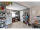 Cozy kitchen features open shelving, light wood flooring and neutral gray walls at 358 S Osceola St, Denver, CO 80219
