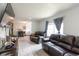 Spacious living room featuring modern flooring, comfortable seating, and large windows for ample natural light at 358 S Osceola St, Denver, CO 80219