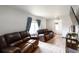 Spacious living room with neutral walls, comfortable seating, and modern flooring for a welcoming atmosphere at 358 S Osceola St, Denver, CO 80219