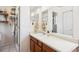 Bathroom featuring a vanity, updated mirrors, and custom towel storage at 7822 W Ottawa Pl, Littleton, CO 80128
