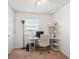 Office space in bedroom with natural light and organized shelving at 7822 W Ottawa Pl, Littleton, CO 80128