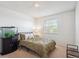 Bright bedroom featuring an aquarium and large window at 7822 W Ottawa Pl, Littleton, CO 80128