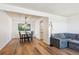 Dining area featuring hardwood floors, a modern chandelier, and an abundance of natural light at 7822 W Ottawa Pl, Littleton, CO 80128