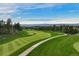 Expansive aerial view of the manicured golf course with a scenic walking path at 120 Silver Leaf Way, Castle Rock, CO 80108