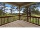 An outdoor patio with wood decking shows a gorgeous view of the golf course and surrounding landscape at 120 Silver Leaf Way, Castle Rock, CO 80108