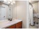 A bathroom with a vanity, large mirror, and shower and bath combo at 120 Silver Leaf Way, Castle Rock, CO 80108