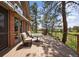 Spacious deck with outdoor seating, perfect for enjoying the tranquil scenery and golf course views at 120 Silver Leaf Way, Castle Rock, CO 80108