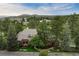 Aerial view of a brick home and lush surroundings near golf course at 120 Silver Leaf Way, Castle Rock, CO 80108