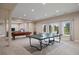Spacious game room with pool table, ping pong table, and an open layout perfect for entertaining at 120 Silver Leaf Way, Castle Rock, CO 80108