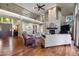 Spacious living area with hardwood floors, a fireplace, and stylish furnishings under a high ceiling at 120 Silver Leaf Way, Castle Rock, CO 80108