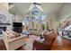 Inviting living room with high ceilings, stone fireplace, hardwood floors and plenty of natural light at 120 Silver Leaf Way, Castle Rock, CO 80108
