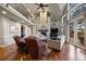 Elegant living room featuring a stone fireplace, hardwood floors and large glass doors to the deck at 120 Silver Leaf Way, Castle Rock, CO 80108