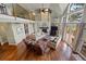 Elegant living room featuring a stone fireplace, hardwood floors, loft and large glass doors to the deck at 120 Silver Leaf Way, Castle Rock, CO 80108