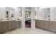 Luxurious main bathroom featuring dual vanities and doorway leading to main bedroom at 120 Silver Leaf Way, Castle Rock, CO 80108