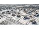 Expansive aerial view of a snow-covered neighborhood with single-Gathering homes at 9904 E 161St Pl, Brighton, CO 80602