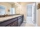 Bathroom featuring a granite countertop on the vanity with double sinks at 9904 E 161St Pl, Brighton, CO 80602