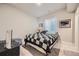 Bedroom with black and white checkered bedding and a window at 9904 E 161St Pl, Brighton, CO 80602