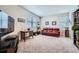 Spacious living room featuring natural light and a comfortable seating area at 9904 E 161St Pl, Brighton, CO 80602