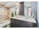 Well-appointed bathroom with a double vanity, neutral tones, and walk-in shower at 120 S Pennsylvania St # 207, Denver, CO 80209