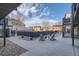 Inviting courtyard with Adirondack chairs, concrete patio, and a serene outdoor space for relaxing and entertaining at 120 S Pennsylvania St # 207, Denver, CO 80209