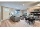 Inviting living area with hardwood floors, comfortable seating, and plenty of natural light at 120 S Pennsylvania St # 207, Denver, CO 80209