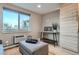Open living room with large window, console table, neutral colors and hardwood flooring at 120 S Pennsylvania St # 207, Denver, CO 80209