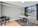 Bright home office with hardwood floors, a modern desk, and large window at 120 S Pennsylvania St # 207, Denver, CO 80209