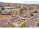 Neighborhood aerial view showcasing mature trees, landscaping, and mountain views at 6523 S Field Way, Littleton, CO 80123