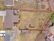Aerial view of the fenced backyard featuring mature trees, hot tub, and garden beds at 6523 S Field Way, Littleton, CO 80123