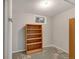 Unfinished basement area with concrete floors and built-in shelving at 6523 S Field Way, Littleton, CO 80123