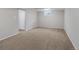 Unfinished basement with neutral carpeting and a small window at 6523 S Field Way, Littleton, CO 80123