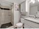 Bathroom boasts glass shower, modern vanity, and stylish fixtures at 6523 S Field Way, Littleton, CO 80123